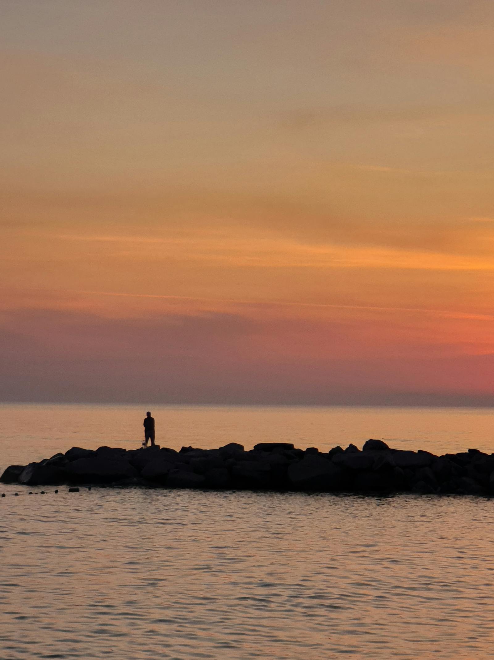 Dawn over the water — fishing boats preparing for the morning run.